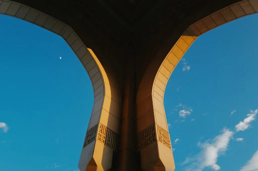 View from under a bridge looking up at the sky