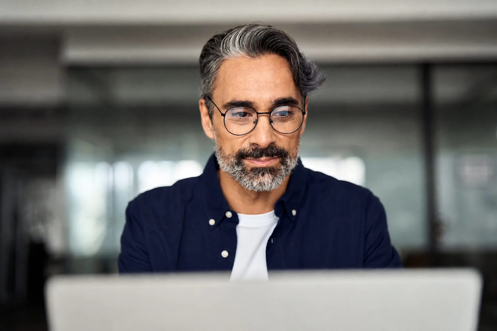 Man using laptop concentrating